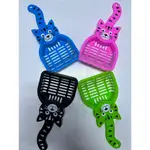 Cat litter cleaning brush.